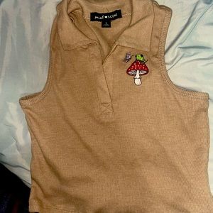 (Not worn) brown/tan cropped top with a collar. Marked as size S. Embroidered.